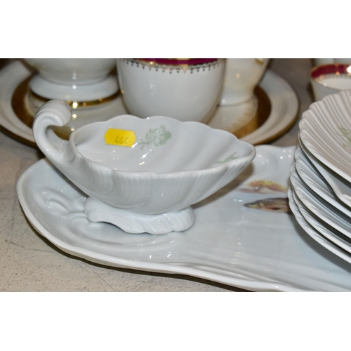 464 - A LIMOGES PORCELAIN FISH SERVICE SET, comprising serving platter and jug and six scalloped shaped pl... 