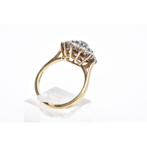 5 - A 9CT GOLD DRESS RING, tiered cluster set with circular cut colourless stones assessed as paste, wit... 