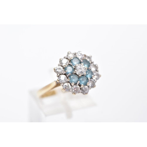 5 - A 9CT GOLD DRESS RING, tiered cluster set with circular cut colourless stones assessed as paste, wit... 