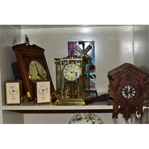 508 - SIX CLOCKS COMPRISING A GERMAN ANNUAL ANNIVERSARY CLOCK, two Rapport of London carriage clocks, cuck... 