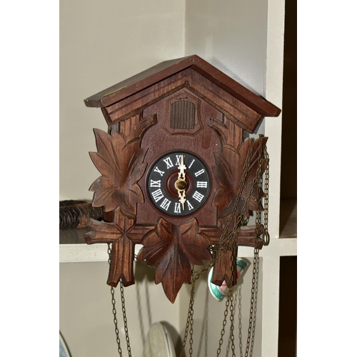 508 - SIX CLOCKS COMPRISING A GERMAN ANNUAL ANNIVERSARY CLOCK, two Rapport of London carriage clocks, cuck... 