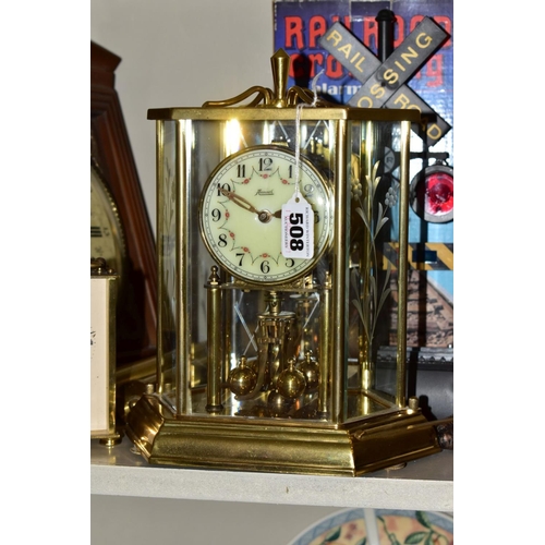 508 - SIX CLOCKS COMPRISING A GERMAN ANNUAL ANNIVERSARY CLOCK, two Rapport of London carriage clocks, cuck... 