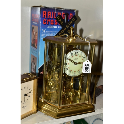 508 - SIX CLOCKS COMPRISING A GERMAN ANNUAL ANNIVERSARY CLOCK, two Rapport of London carriage clocks, cuck... 