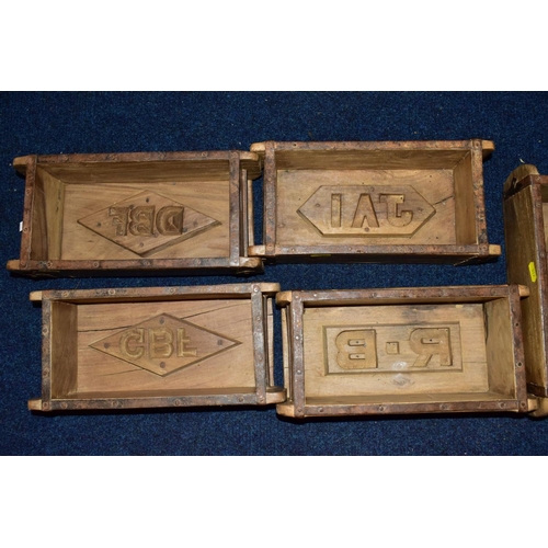 517 - FIVE WOODEN AND METAL BOUND BRICKMAKERS MOULDS, all five with initials/numbers to the interiors, int... 