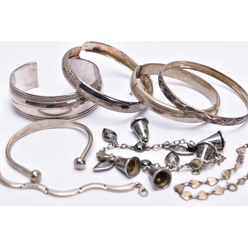 53 - A BAG OF ASSORTED SILVER AND WHITE METAL BRACELETS, to include a silver hinged bangle with a decorat... 