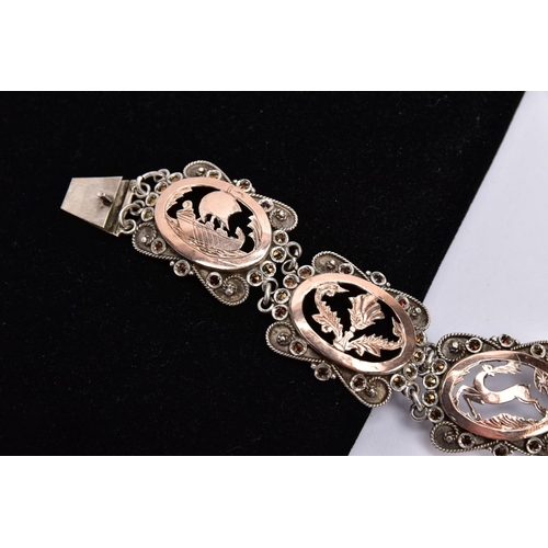 54 - A WHITE METAL AND ROSE GOLD TONE BRACELET, designed with five openwork links, set with rose gold col... 