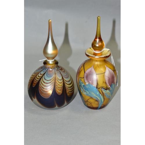 540 - TWO IRIDESCENT PERFUME BOTTLES AND STOPPERS, one of baluster form, height 16cm, the other of bulbous... 