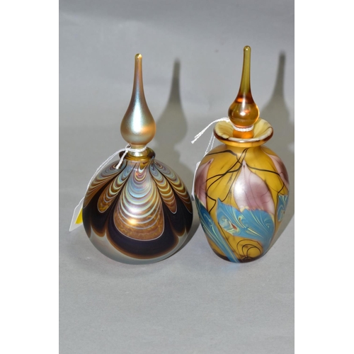 540 - TWO IRIDESCENT PERFUME BOTTLES AND STOPPERS, one of baluster form, height 16cm, the other of bulbous... 