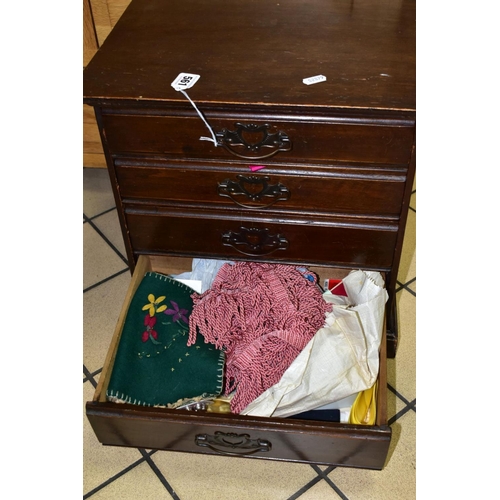 561 - A SMALL EDWARDIAN WALNUT STAINED CHEST OF FOUR DRAWERS CONTAINING NEEDLEWORK EQUIPMENT, etc, includi... 