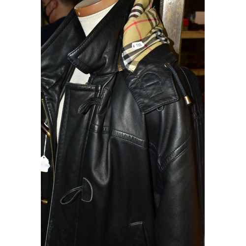 563 - A BURBERRY BLACK LEATHER DUFFLE COAT, labelled as '42', with Burberry check lining and with hood att... 