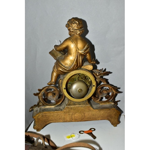 568 - A LATE 19TH CENTURY FRENCH GILT METAL FIGURAL MANTEL CLOCK, the case cast with a putti holding an op... 