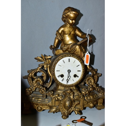 568 - A LATE 19TH CENTURY FRENCH GILT METAL FIGURAL MANTEL CLOCK, the case cast with a putti holding an op... 