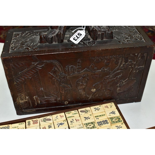 573 - A LATE 19TH/EARLY 20TH CENTURY MAH JONG SET, the bone and bamboo playing pieces housed in a relief c... 