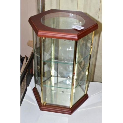 575 - A MODERN HEXAGONAL TABLE TOP DISPLAY CASE, the wooden top with circular glazed panel above six glaze... 