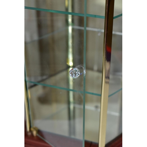 575 - A MODERN HEXAGONAL TABLE TOP DISPLAY CASE, the wooden top with circular glazed panel above six glaze... 