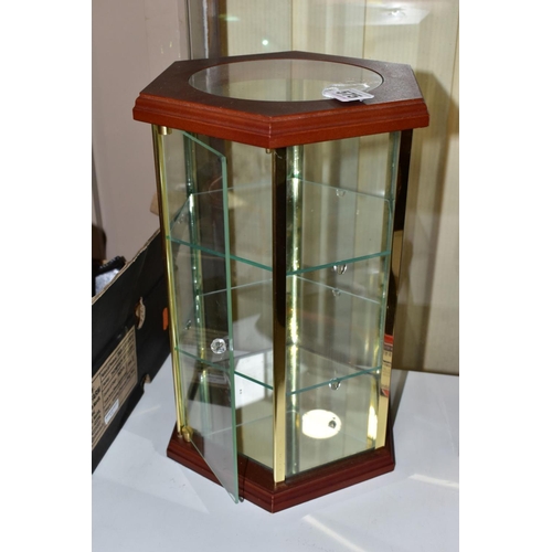 575 - A MODERN HEXAGONAL TABLE TOP DISPLAY CASE, the wooden top with circular glazed panel above six glaze... 