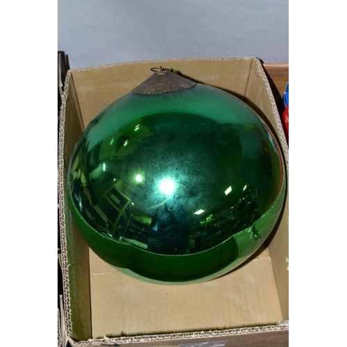 578 - A LATE 19TH/EARLY 20TH CENTURY METALLIC GREEN GLASS WITCH'S BALL with metal mount and short length o... 