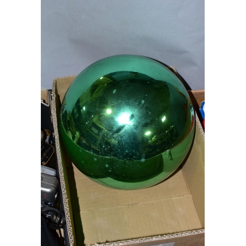 578 - A LATE 19TH/EARLY 20TH CENTURY METALLIC GREEN GLASS WITCH'S BALL with metal mount and short length o... 