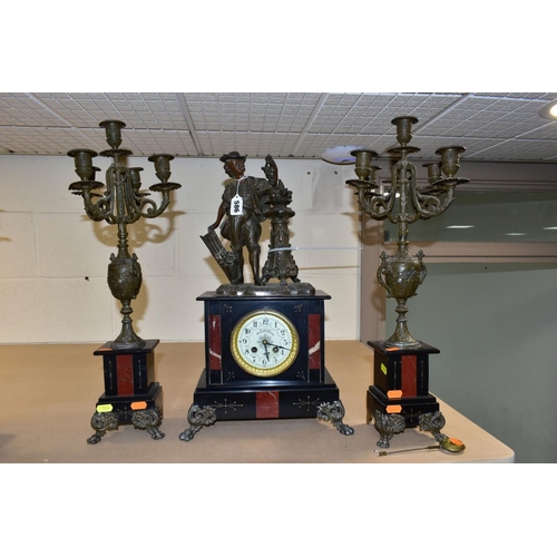 586 - A LATE 19TH CENTURY BLACK SLATE, MARBLE AND BRONZED CLOCK GARNITURE, the clock with figural surmount... 