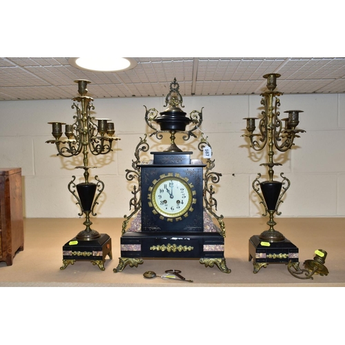 587 - A LATE 19TH CENTURY BLACK SLATE, MARBLE AND GILT METAL CLOCK GARNITURE, the clock with urn shaped su... 