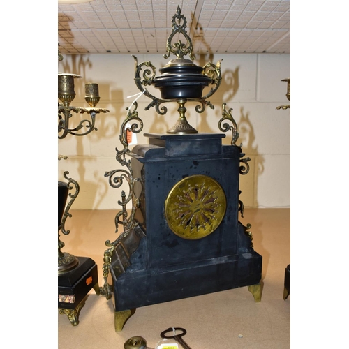 587 - A LATE 19TH CENTURY BLACK SLATE, MARBLE AND GILT METAL CLOCK GARNITURE, the clock with urn shaped su... 