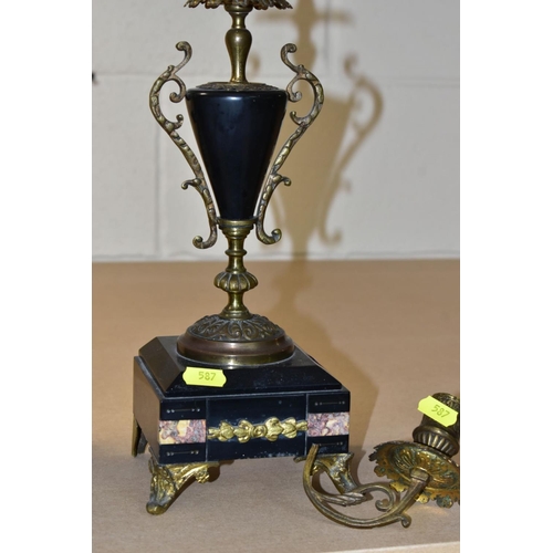 587 - A LATE 19TH CENTURY BLACK SLATE, MARBLE AND GILT METAL CLOCK GARNITURE, the clock with urn shaped su... 