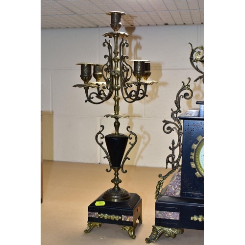 587 - A LATE 19TH CENTURY BLACK SLATE, MARBLE AND GILT METAL CLOCK GARNITURE, the clock with urn shaped su... 