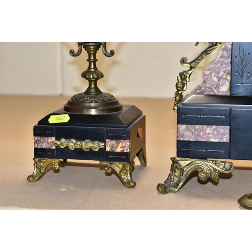 587 - A LATE 19TH CENTURY BLACK SLATE, MARBLE AND GILT METAL CLOCK GARNITURE, the clock with urn shaped su... 