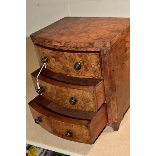 588 - A VICTORIAN BURR WALNUT VENEERED MINIATURE BOW FRONT CHEST OF THREE DRAWERS, turned wooden handles, ... 