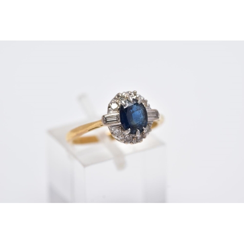 60 - A LATE 20TH CENTURY 18CT GOLD SAPPHIRE AND DIAMOND OVAL CLUSTER RING, centring on a mixed cut sapphi... 