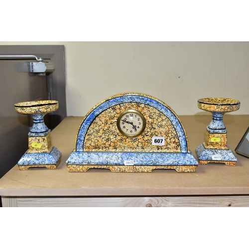 607 - A CONTINENTAL CLOCK GARNITURE, the dome shaped  porcelain clock is branded M.W inside a triangle, ap... 