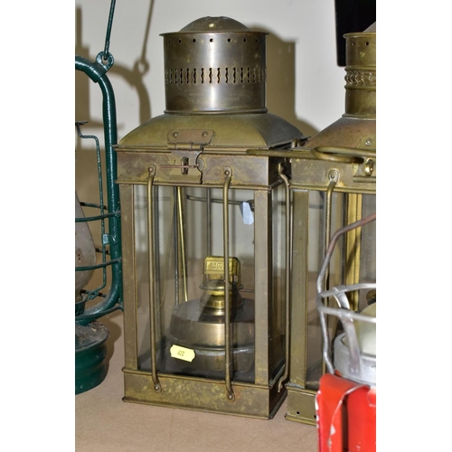 622 - TWO PARAFFIN/OIL STORM LANTERNS, both use 1 inch wicks, approximate height 39cm, together with a vin... 