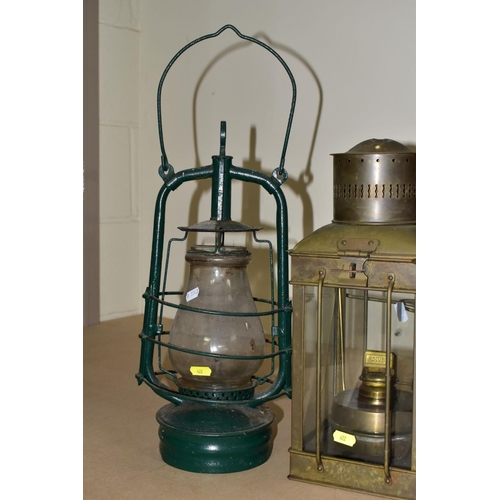 622 - TWO PARAFFIN/OIL STORM LANTERNS, both use 1 inch wicks, approximate height 39cm, together with a vin... 