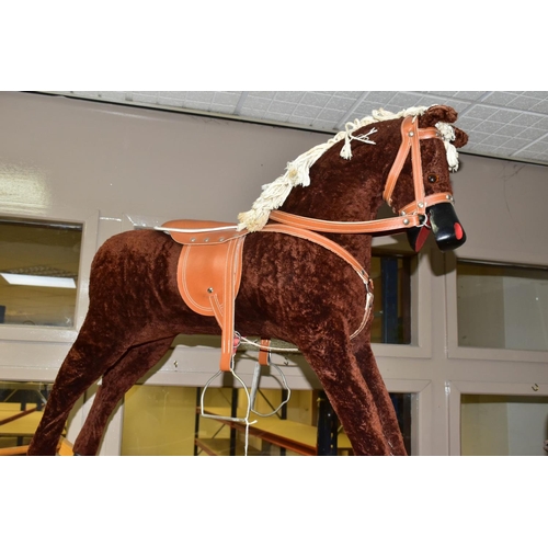 636 - A MODERN WOODEN ROCKING HORSE, covered in brown plush with string tail and mane, painted mouth, nose... 