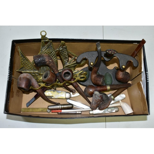 644 - A SMALL BOX OF SUNDRIES, to include various pipes (one with sterling silver collar) and stands, pen ... 