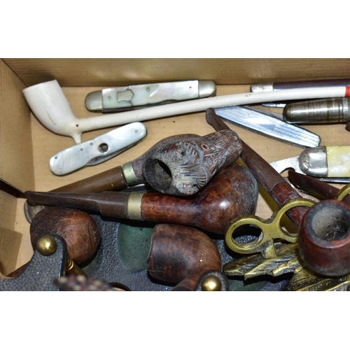 644 - A SMALL BOX OF SUNDRIES, to include various pipes (one with sterling silver collar) and stands, pen ... 