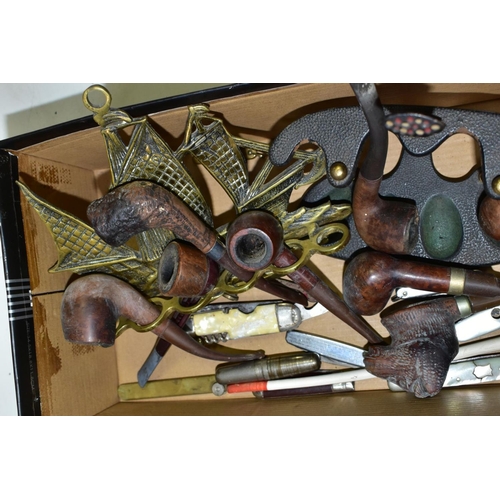 644 - A SMALL BOX OF SUNDRIES, to include various pipes (one with sterling silver collar) and stands, pen ... 