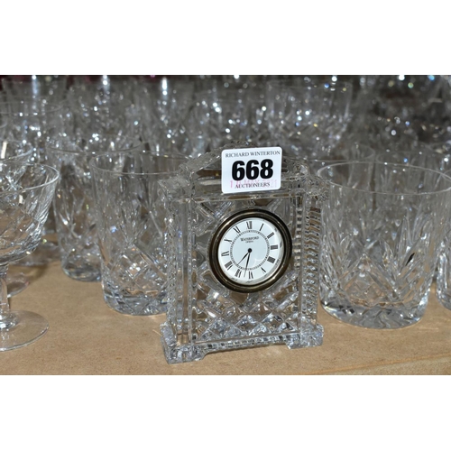 668 - A QUANTITY OF GLASSWARE, including a Waterford Crystal quartz mantel clock, height 11cm, coloured an... 