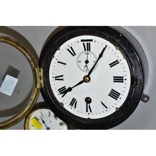 672 - A METAL CASED SHIPS STYLE CLOCK, the white enamelled dial has Roman numerals and a separate seconds ... 