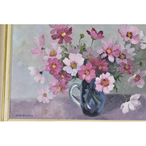 699 - JOAN HADFIELD (20TH CENTURY), two oil on canvas flower studies, the first depicts daffodils and yell... 