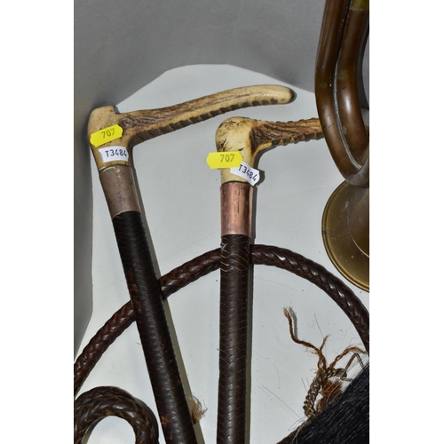 707 - TWO LEATHER WHIPS, bone handles, metal mounts one with engraved coronet, worn condition, with a semi... 