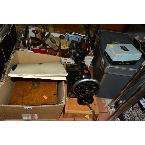 710 - A KENBAR CAST IRON SEWING MACHINE, black painted with floral decoration on wooden base, with a boxed... 