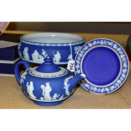 734 - THREE PIECES OF WEDGWOOD BLUE JASPERWARE, comprising a pedestal fruit bowl, the applied decoration o... 