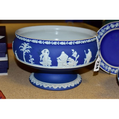 734 - THREE PIECES OF WEDGWOOD BLUE JASPERWARE, comprising a pedestal fruit bowl, the applied decoration o... 