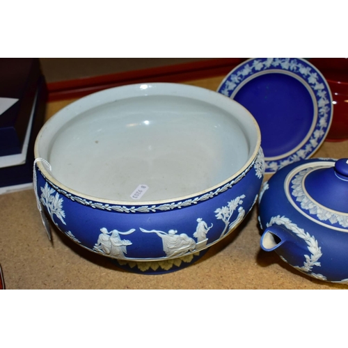 734 - THREE PIECES OF WEDGWOOD BLUE JASPERWARE, comprising a pedestal fruit bowl, the applied decoration o... 