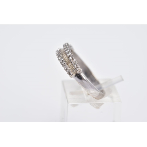 94 - A 9CT WHITE GOLD HALFHOOP DIAMOND RING, designed with a central row of rectangular cut diamonds betw... 