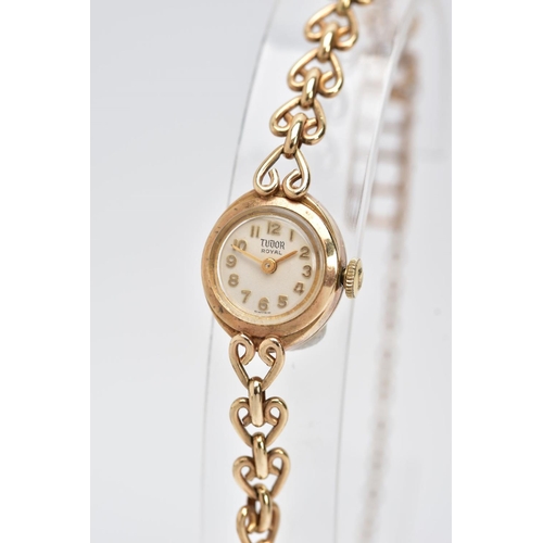 213 - A 9CT GOLD HAND WOUND ROLEX TUDOR LADY'S WRISTWATCH, a round case measuring approximately 15mm in di... 