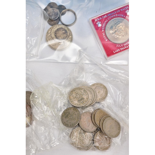 219 - A PLASTIC TUB OF MAINLY UK 20TH CENTURY COINAGE to include a mens ring made out of a 1929 halfcrown,... 