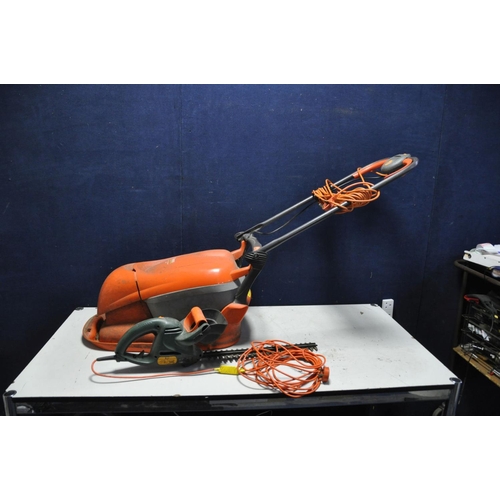 1075 - A FLYMO HOVER COMPACT 300 LAWN MOWER (PAT pass and working) and a Black and Decker hedge trimmer (un... 