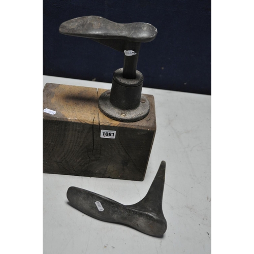 1081 - A VINTAGE COBBLERS REPAIR BLOCK with two shoe lasts and a holder mounted on a wooden block (3)